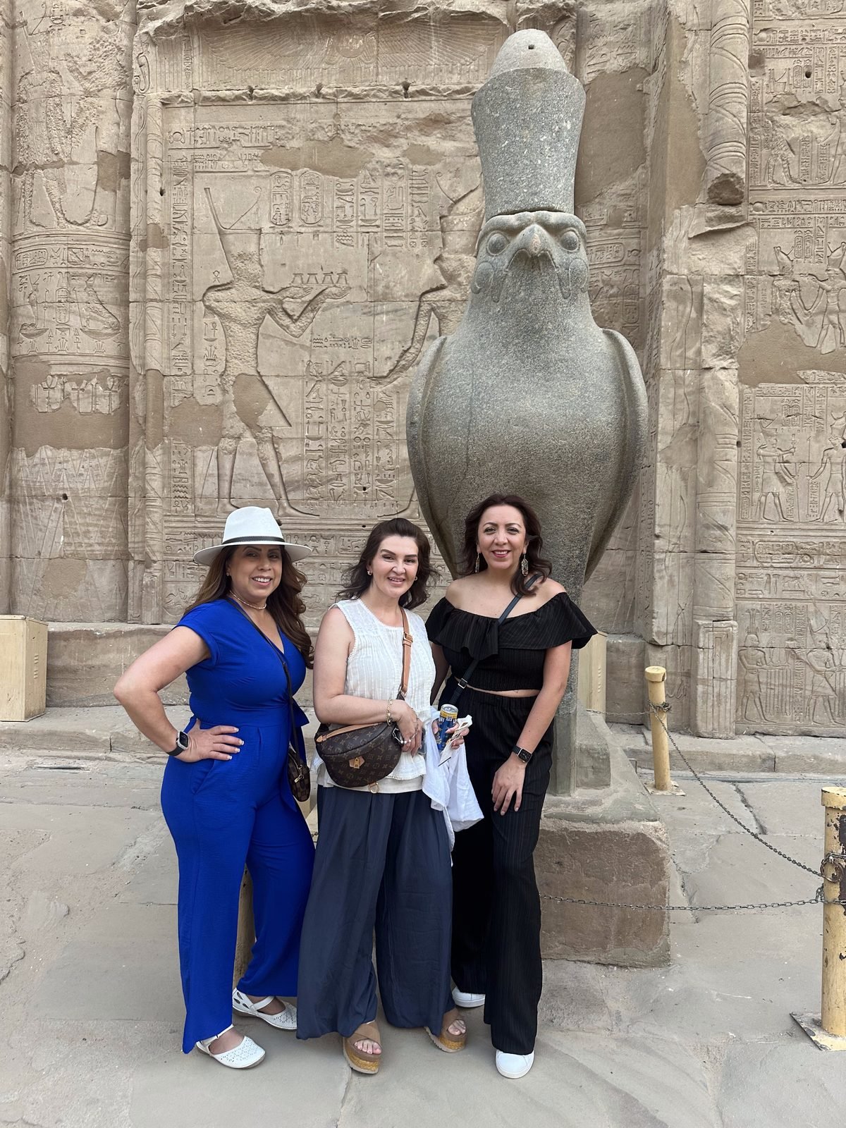 Guests of ours at the temple of Edfu, dressed for a hot morning at the temples