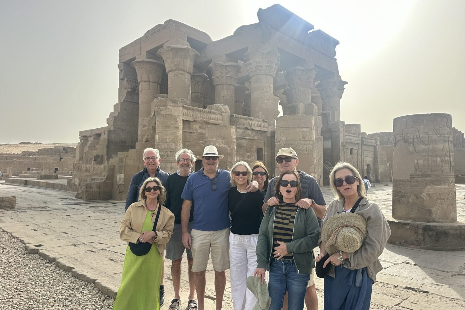 Nile Cruising guests with their guide in front of a temple in Upper Egypt