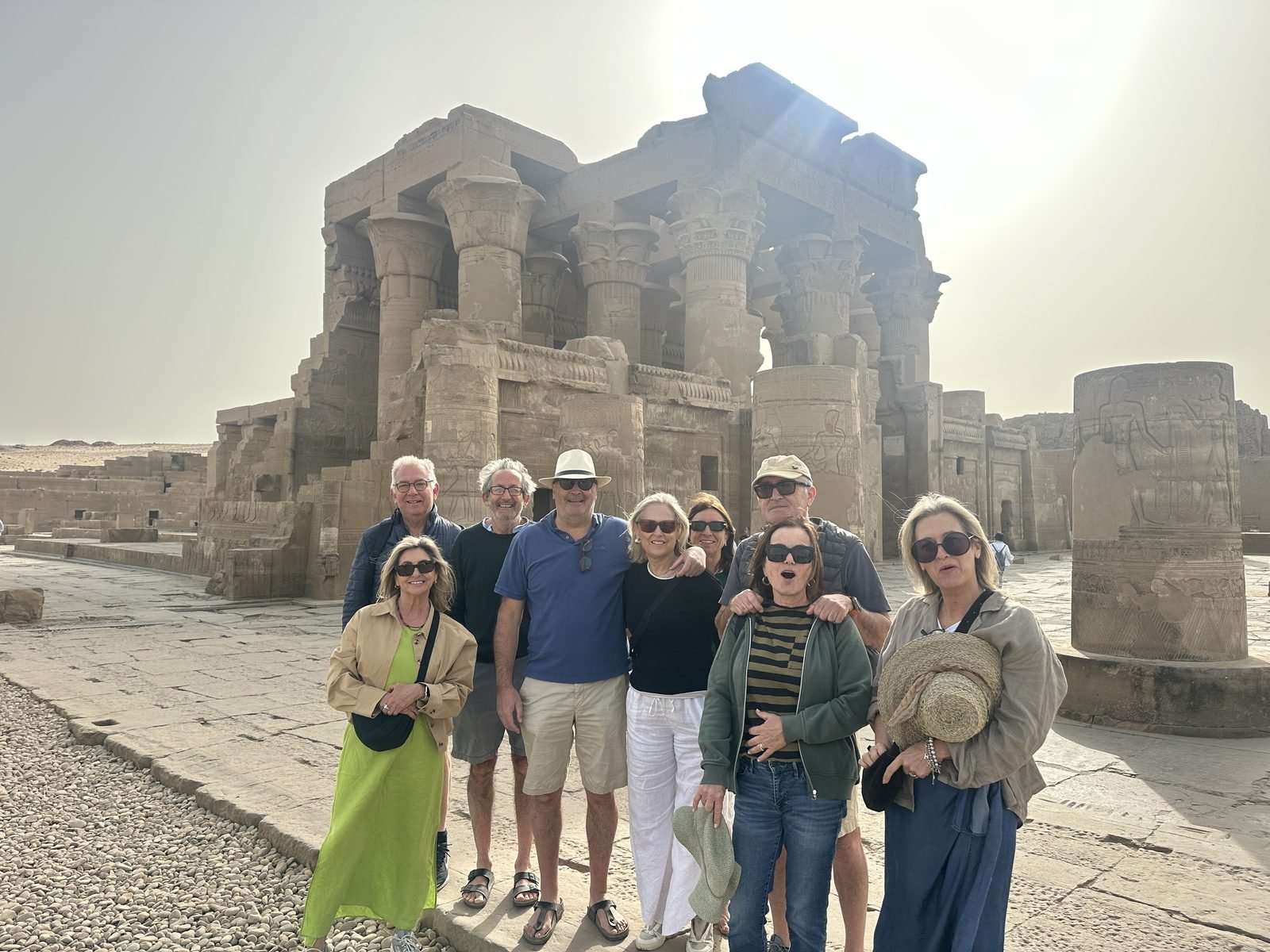 Nile Cruising guests with their guide in front of a temple in Upper Egypt