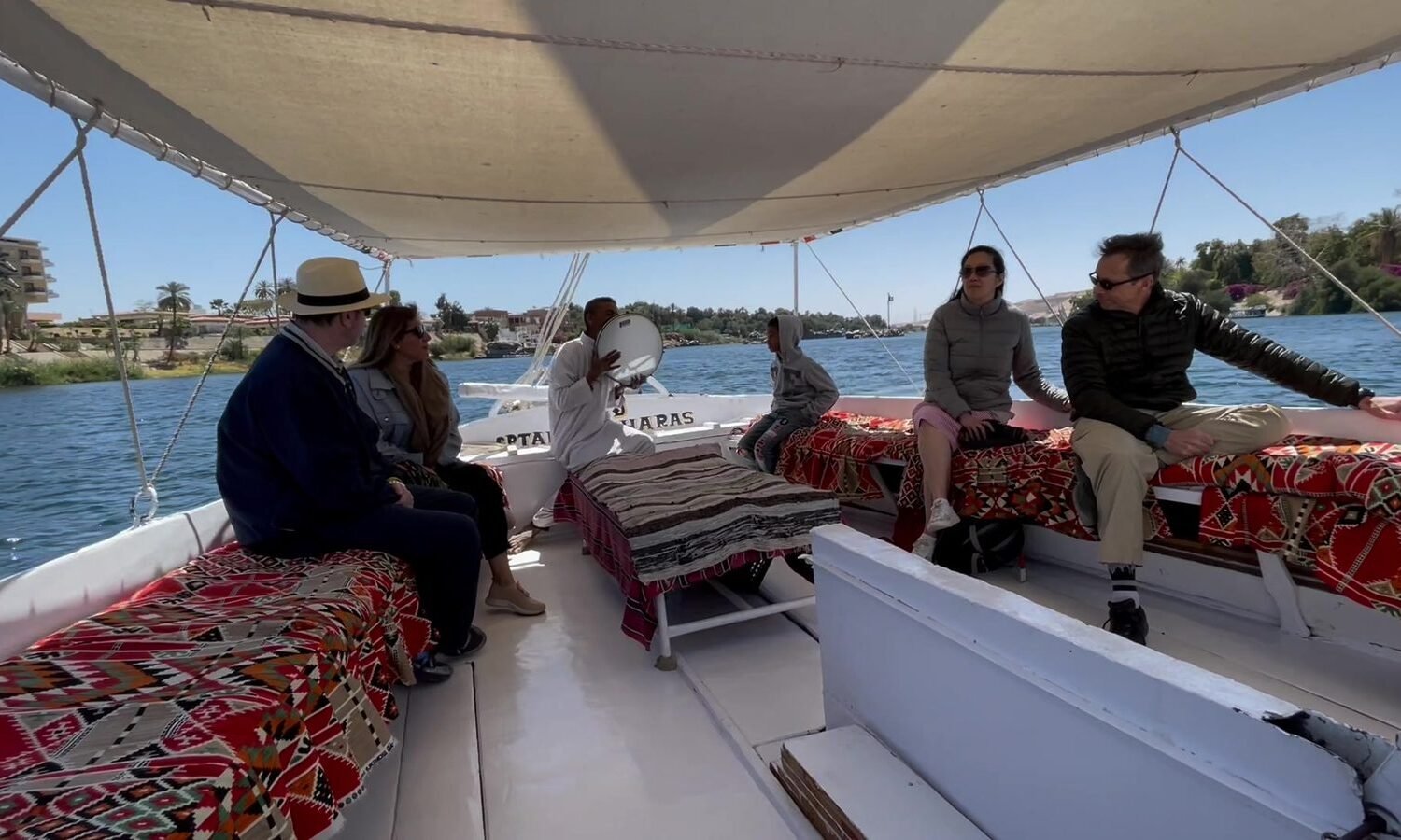 Guests sailing on a felucca on the Nile