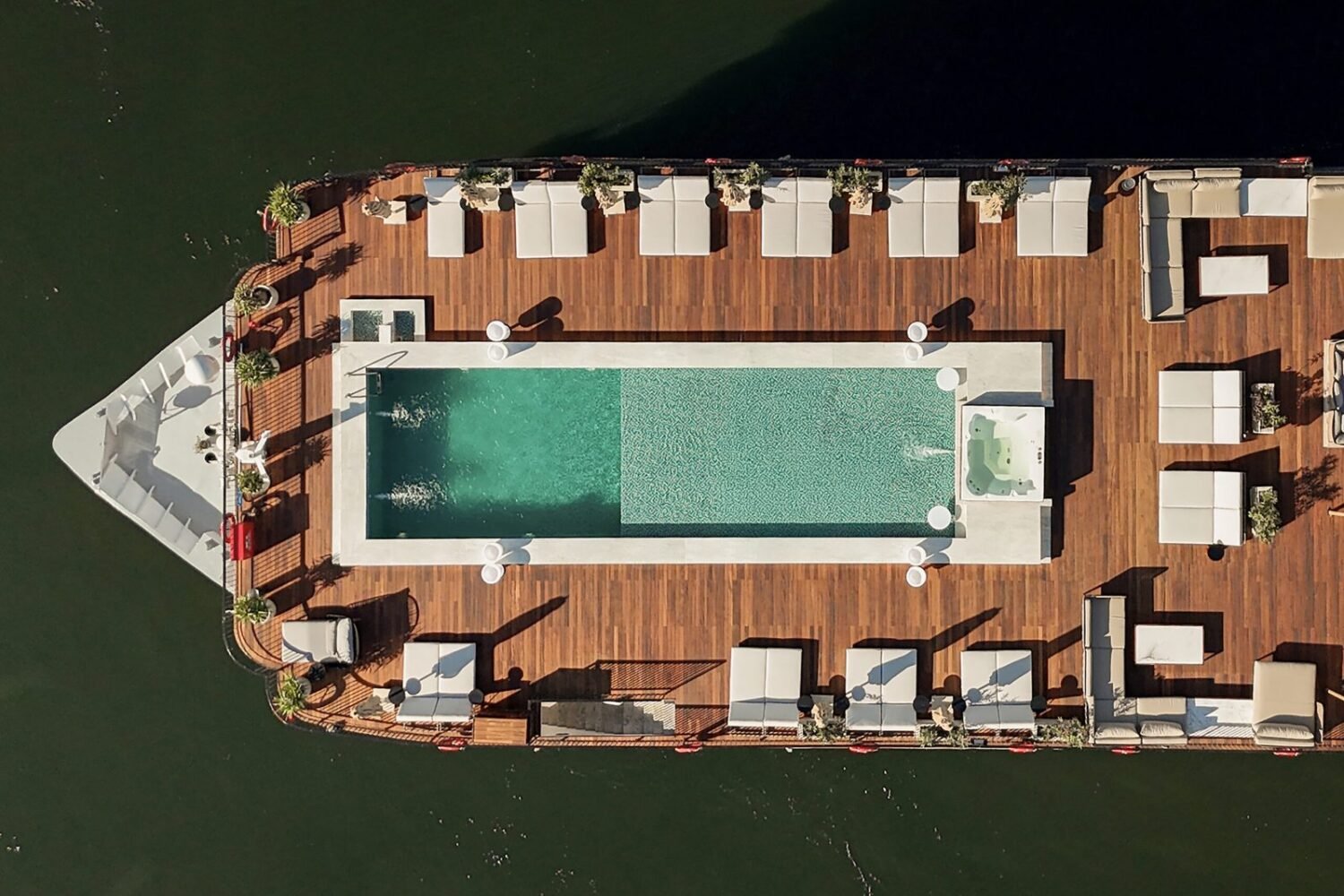 The sundeck and pool of Le Fayan Suites from above