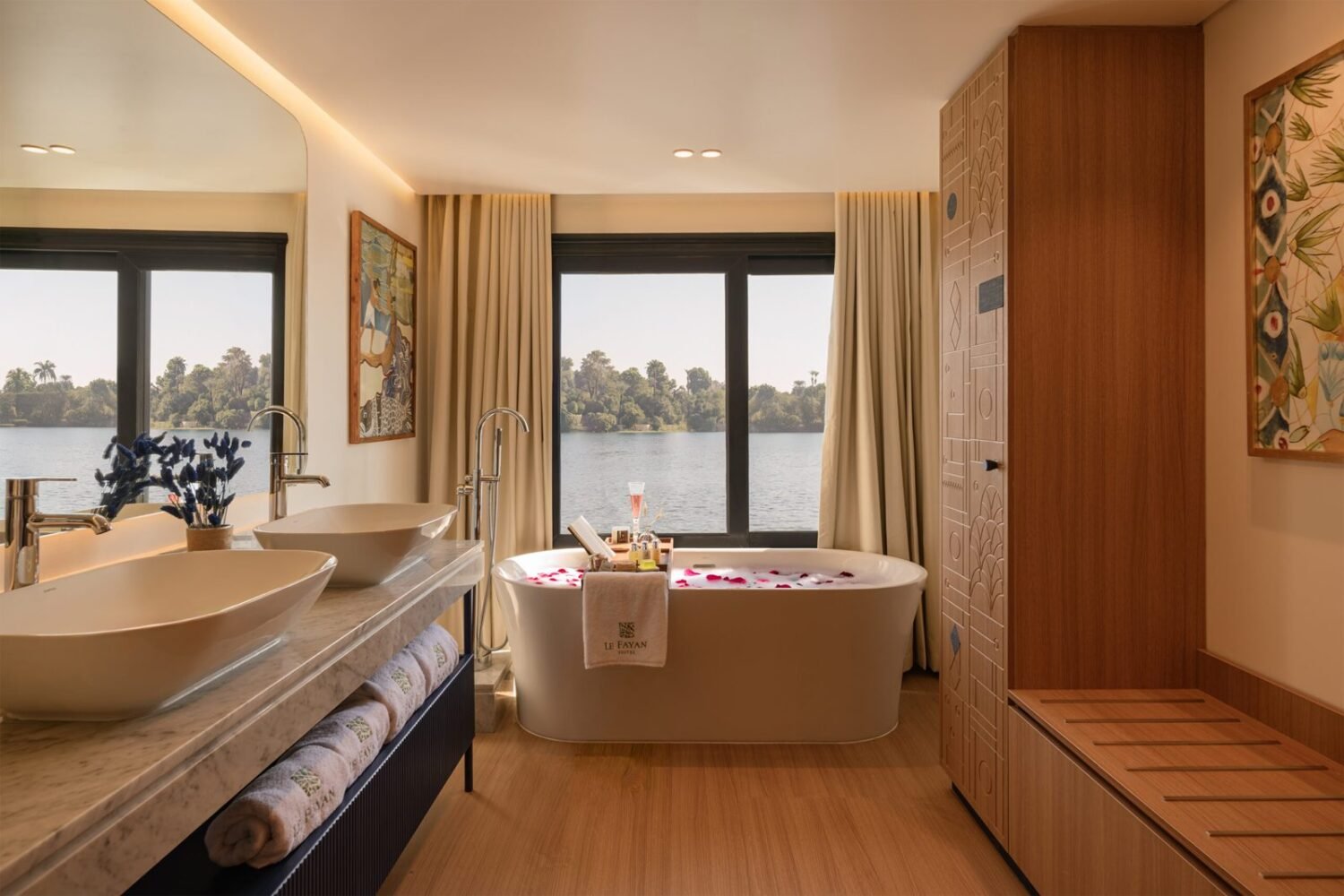 Bathtub by the window in a Le Fayan Suites suite