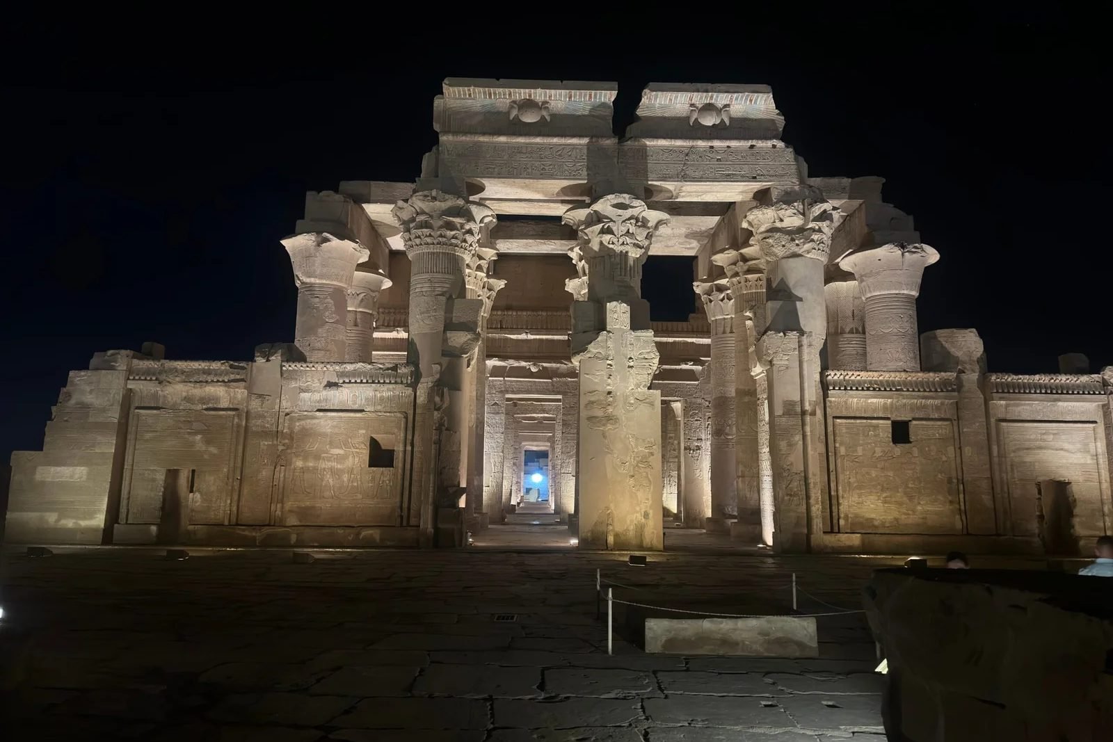 Kom Ombo temple facade lit at night during a private opening, with nobody inside