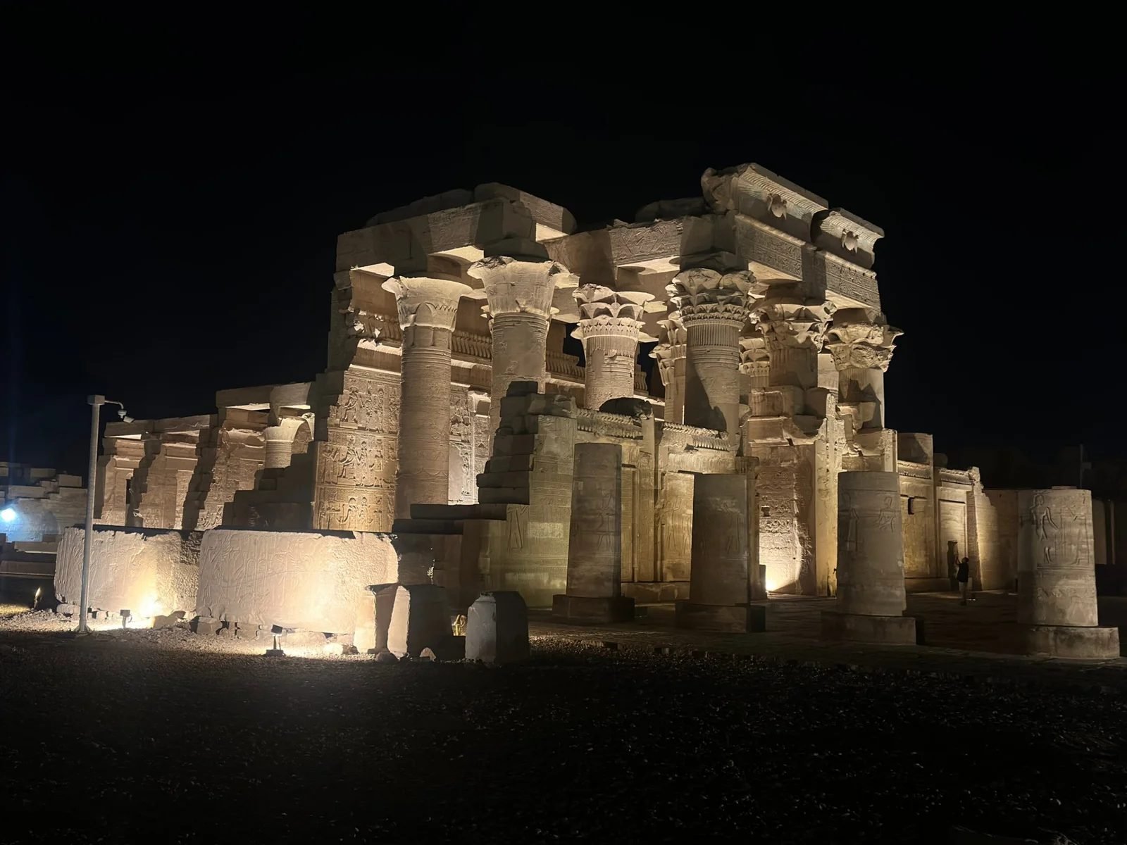 Kom Ombo temple seen from the side at night with an empty forecourt
